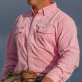 Cowboy on horse in a pink corduroy shirt