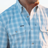 Man wearing button down blue plaid shirt
