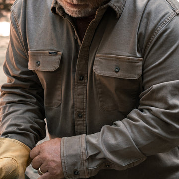 The Monteagle gray button up shirt worn by a man outdoors