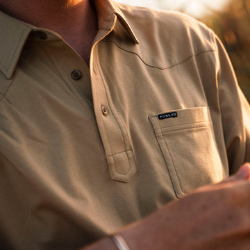 man wearing yellow/tan polo shirt