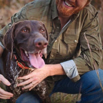 man smiling with dog