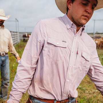 man wearing maroon long sleeve shirt