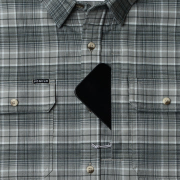 Phone in chest zipper pocket of shirt