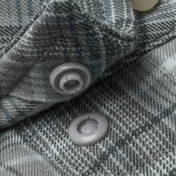 Closeup of collar snaps on collar of shirt