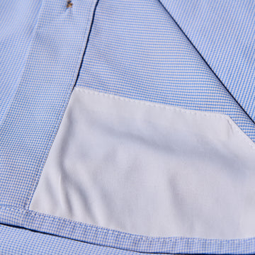sunglass cleaner on blue and plaid microcheck shirt
