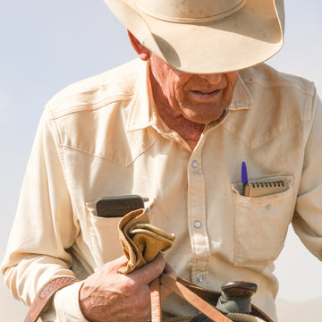 Cowboy wearing white denim shirt