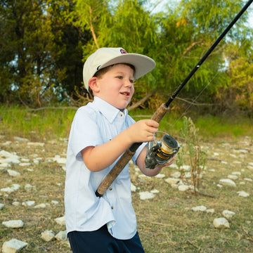 Kid fishing in a blue microcheck kids shirt