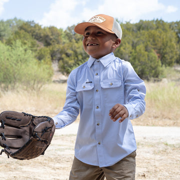 kid with baseball glove wearing blue button down