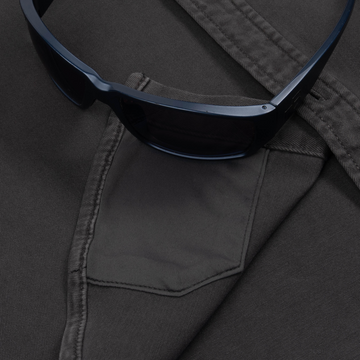 sunglasses with lens cleaner on shirt