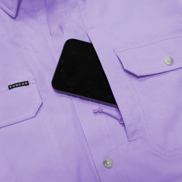 closeup of phone going into chest pocket