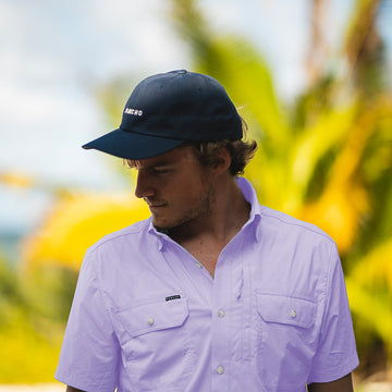 man wearing purple short sleeve shirt