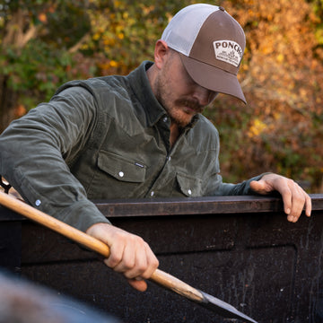 man wearing brown agave trucker hat