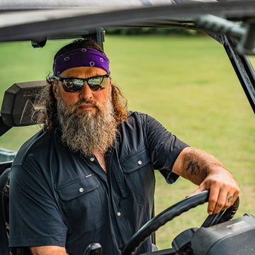 Man driving off road vehicle