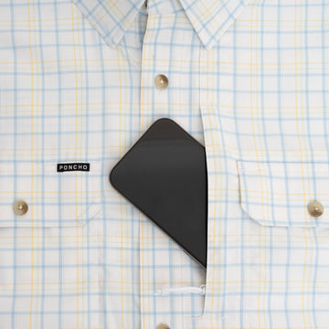 Phone in chest pocket of blue and yellow plaid shirt
