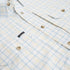 Close up of chest pockets on blue and yellow button down shirt