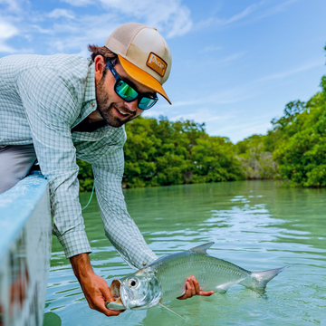 man with fish with cactus logo hat