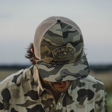 man with camo wild and free hat