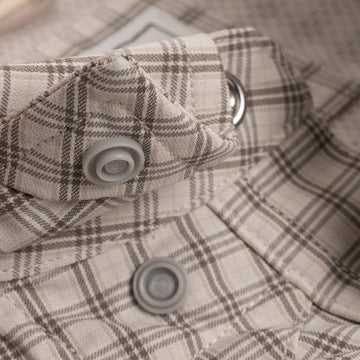 Close up of collar snaps on brown pearl snap