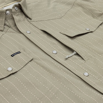 Closeup of pearl snaps and chest pockets