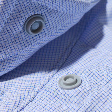 close up of button snaps on blue micro check shirt