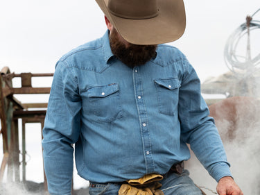 man wearing blue denim shirt