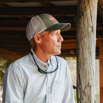 man wearing grey micro grid button up shirt
