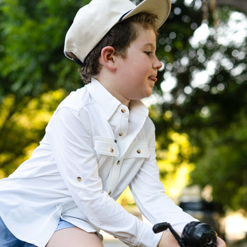 Kid fishing in white shirt