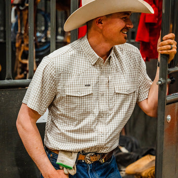 Man wearing pearl snap short sleeve shirt