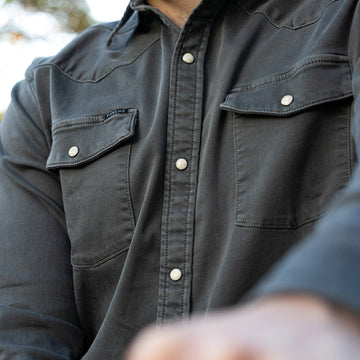 Detail shot of dark grey denim shirt