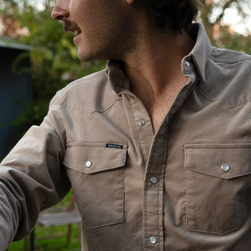 Man outside wearing grey corduroy shirt