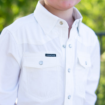 Detail shot of white pearl snap kid's shirt