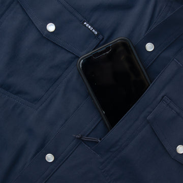 closeup of phone going into navy chest pocket