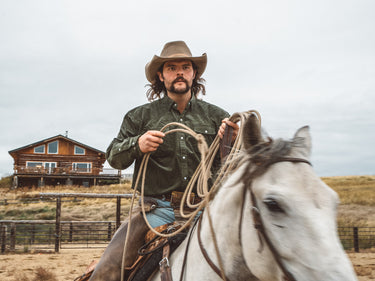 Cowboy wearing green corduroy shirt