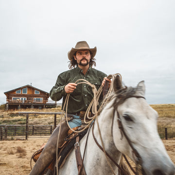 Cowboy wearing green corduroy shirt