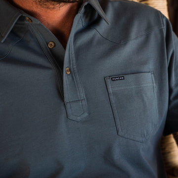 man wearing blue polo shirt