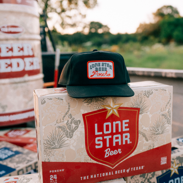 The Dive Hat displayed on a Lone Star beer box in an outdoor setting