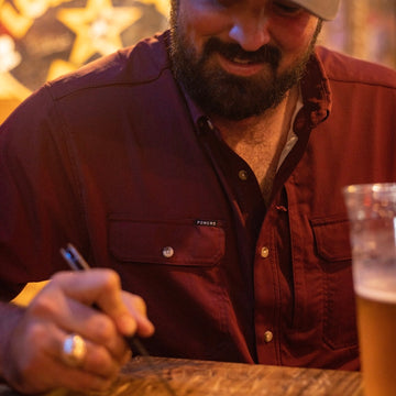 man wearing short sleeve maroon shirt