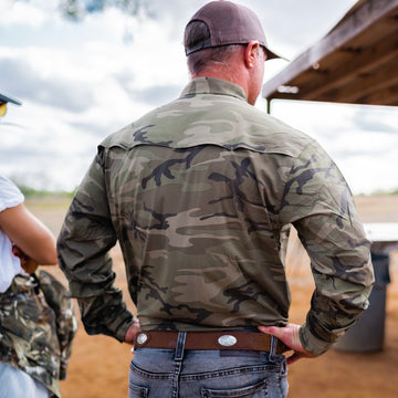 man wearing long sleeve dark camo shirt