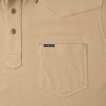 pcoket and buttons of yellow/tan polo shirt