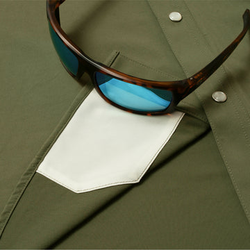 sunglasses with lens cleaner on shirt