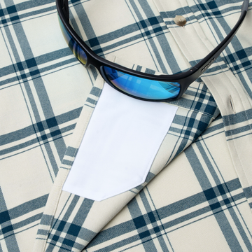 closeup of lens sunglasses with lens cleaner on shirt