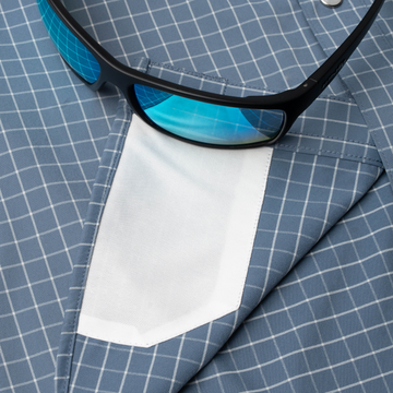 sunglasses with lens cleaner on shirt