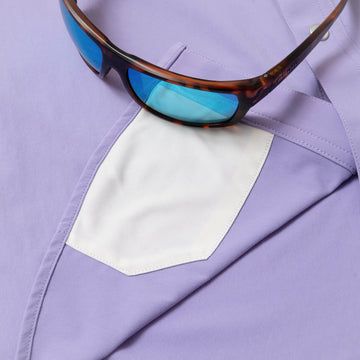 sunglasses with lens cleaner on light purple hirt
