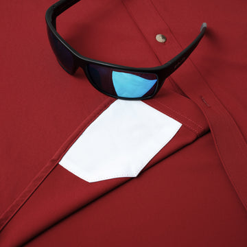 sunglasses with lens cleaner on shirt