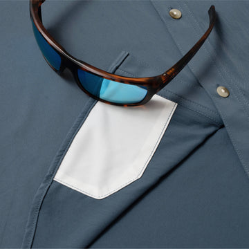 photo of sunglasses with lens cleaner on shirt