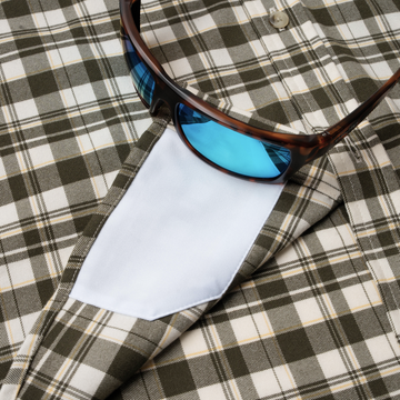 sunglasses with lens cleaner on shirt