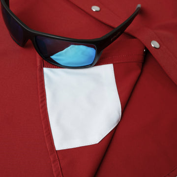 sunglasses with lens cleaner on shirt