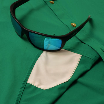 sunglasses with lens cleaner on shirt