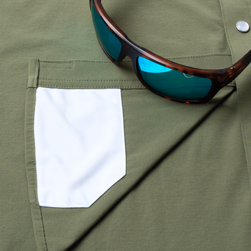 sunglasses with lens cleaner on shirt