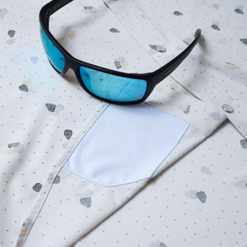 sunglasses with lens cleaner on shirt